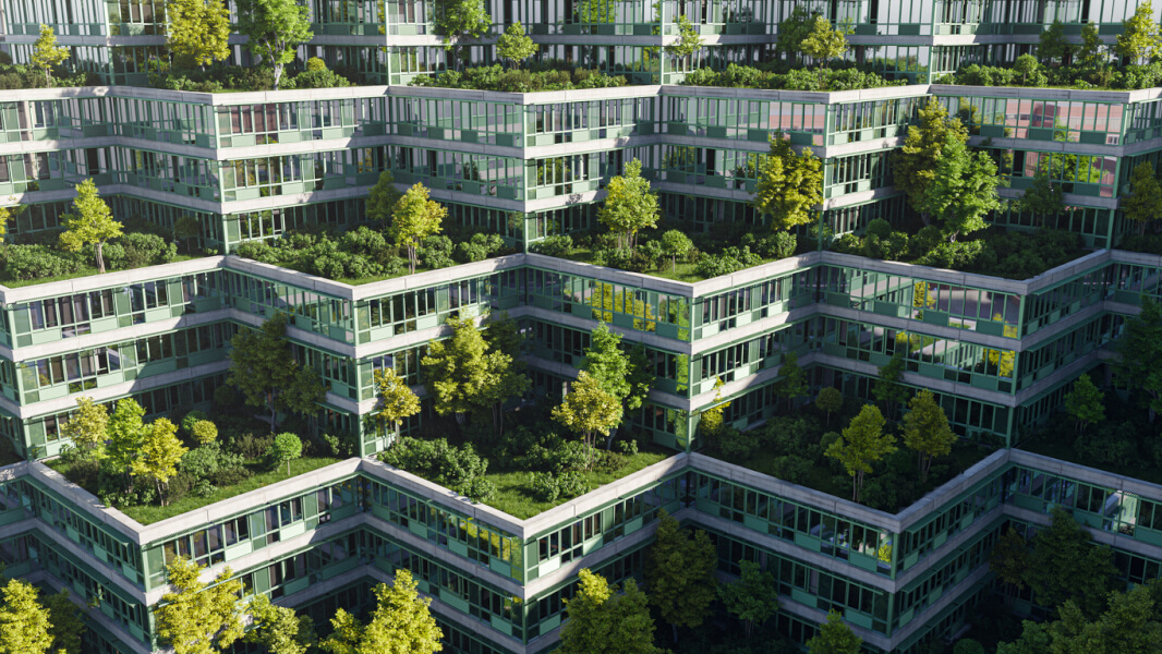 Complexe d'habitations modernes écologiques vu du ciel illustrant des logements sociaux innovants avec terrasses végétalisées et espaces verts intégrés. Chaque appartement bénéficie de jardins suspendus garnis d'arbres et de plantes, favorisant une meilleure qualité de vie et une intégration harmonieuse dans un environnement urbain durable. Une illustration concrète des solutions de logements sociaux respectueux de l'environnement.
